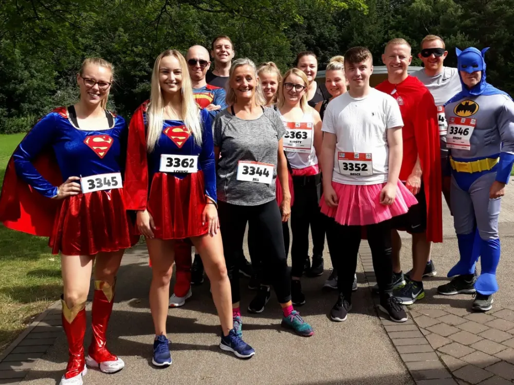 Photo of a group of colleagues in super-hero fancy dress.