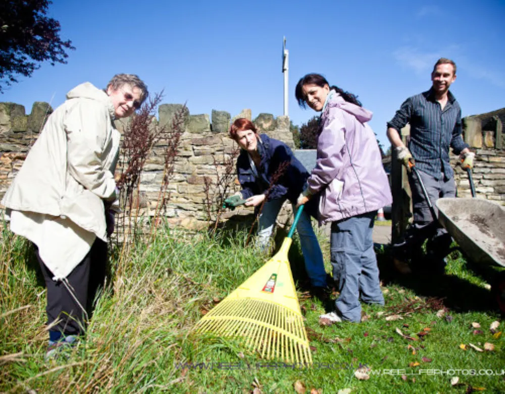 Group of people doing some grounds maintenance