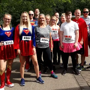 Photo of a group of colleagues in super-hero fancy dress.