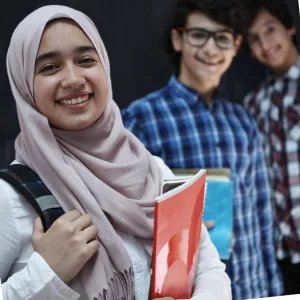 photo of school girl in hijab smiling